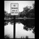 no swimming sign with mixed message
