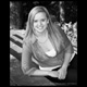 black and white portrait of a woman on stone steps in kennebunk maine